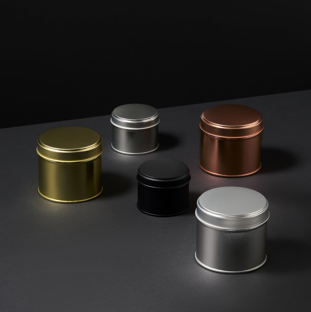 Collectie blikken met gelaste zijnaad in zwart, roségoud, zilver en goud